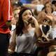 A fan wipes her lip after she was hit on the mouth by a foul ball at a Chicago White Sox game.